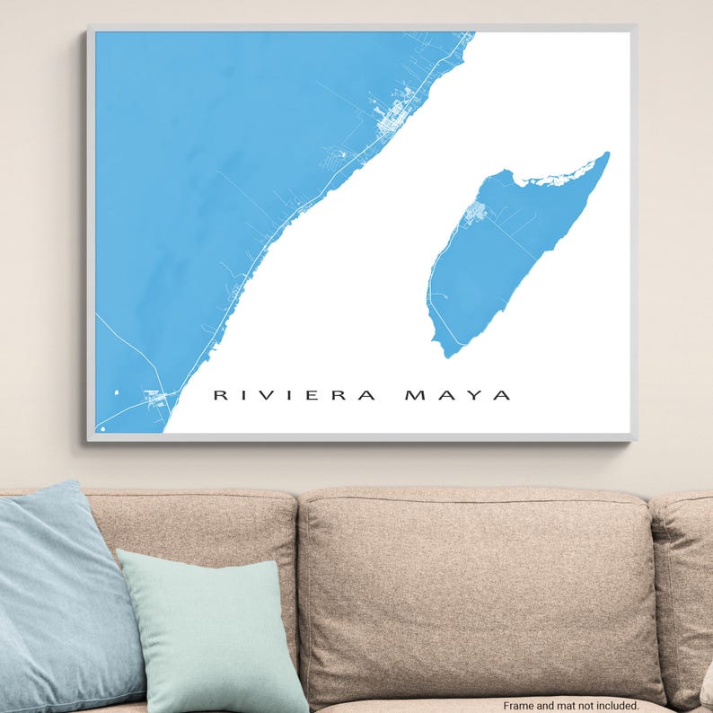 May include: A framed map print of Riviera Maya, featuring a light blue coastal area against a white background. The text "RIVIERA MAYA" is centered at the bottom in a black, sans-serif font. The print is in a white frame.