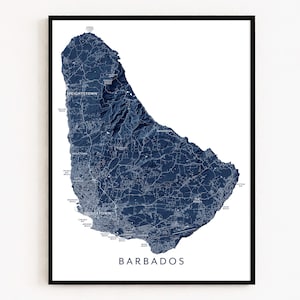 May include: Framed print of Barbados, a detailed navy blue topographical map. The map shows cities and roads, with the island's name in a modern font at the bottom. The print is set against a white background, ideal for home decor.