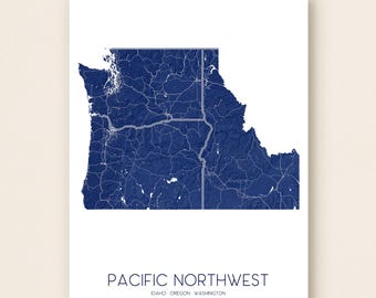 May include: A navy blue and white print of the Pacific Northwest region, including Idaho, Oregon, and Washington. The map shows roads and geographical features. The words "PACIFIC NORTHWEST" are printed at the bottom.