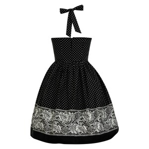 May include: A black halter dress featuring a white polka dot pattern on the bodice and skirt. The hem is decorated with a wide, intricate white floral lace border. The dress includes a matching black and white polka dot tie at the neck.