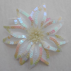 White sequin trimmed flower for bridal floral arrangements, decorations, corsage, or hair accessory.