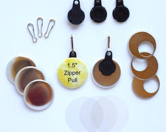 May include: An assortment of craft supplies, including silver-colored clasps, black zipper pull attachments, and metallic-colored circular pieces. One yellow circle reads "1.5" Zipper Pull". Also included are clear, circular adhesive pieces.