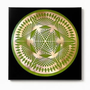 May include: A geometric wall art piece featuring a gold-colored, intricate design set against a vibrant green background. The design is encased in a black square frame. The artwork has a modern and abstract aesthetic.