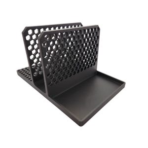 May include: A black desk organiser with a honeycomb pattern on the sides and a tray at the base. The organiser has two vertical sections and a flat base, suitable for holding papers, mail, or office supplies.