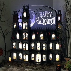 This Halloween Advent Calendar house is hand crafted. It's a spooky Victorian mansion that's sure to amaze you. image 4