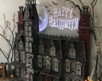 This Halloween Advent Calendar house is hand crafted.  It's a  spooky Victorian mansion that's sure to amaze you.