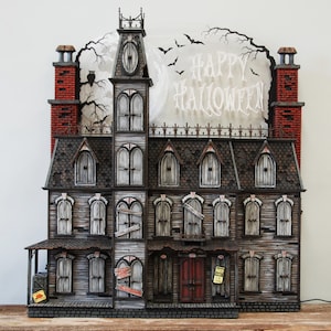 This Halloween Advent Calendar house is hand crafted. It's a spooky Victorian mansion that's sure to amaze you. image 2