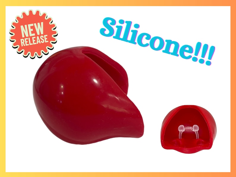 Op de afbeelding: Rood siliconen product met de tekst "Silicone!!!" en "NIEUWE RELEASE". Het product wordt in twee delen getoond. E&eacute;n deel is een afgeronde vorm met een gebogen opening. Het andere deel is kleiner en open.