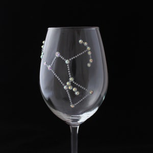 Wine glass hand painted with Oreon constellation design anddecorated with rhinestones