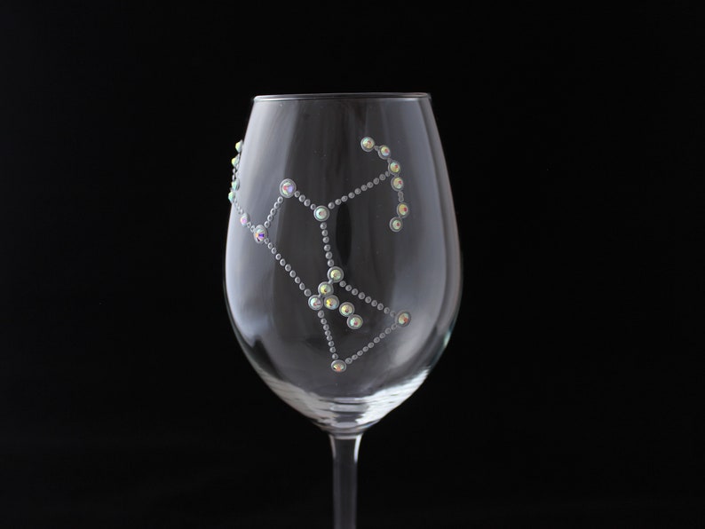 Wine glass hand painted with Oreon constellation design anddecorated with rhinestones