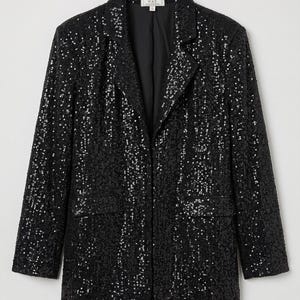 May include: A black blazer covered in shimmering sequins featuring a notched lapel, long sleeves, and two front flap pockets. The interior label reads W.A.Y. It has a structured silhouette with a single button closure and a smooth black lining.