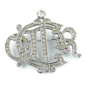 CHRISTIAN DIOR * Silver Toned Insigna Diamante Brooch