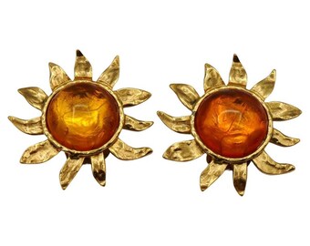 YVES SAINT LAURENT * Coppia di clip per orecchie in resina arancione cabochon con sole in metallo dorato