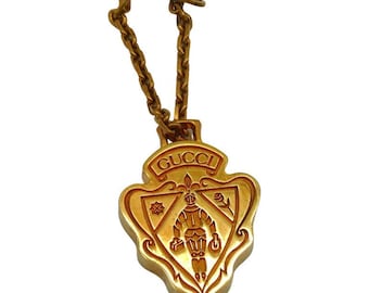 GUCCI Parfums * Accesorio con insignia de metal dorado vintage Nobile