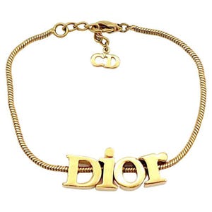 CHRISTIAN DIOR * Vintage Gold Tone Spellout Bracelet