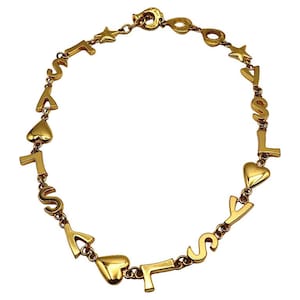 YVES SAINT LAURENT * Collier Emblématique Métal Doré Initiales Cœurs Etoiles Vintage