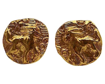 YVES SAINT LAURENT * Vintage guldfärgade örhängen med mytologisk varelse