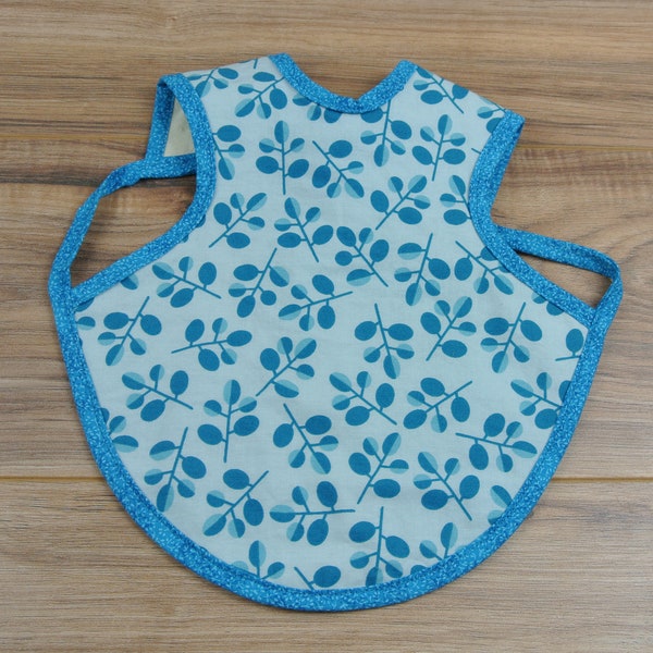Blue Floral Bapron = Bib + Apron. It is a Full Coverage Tie On Bib that protects your Newborn, Baby or Toddler from big messes.