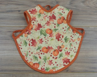 Fall Pumpkin Bapron = Bib + Apron. It is a Full Coverage Tie On Bib that rotects your Newborn, Baby or Toddler from big messes.