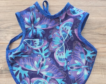 Blue Floral Pattern Bapron = Bib + Apron. It is a Full Coverage Tie On Bib that protects your Newborn, Baby or Toddler from big messes.