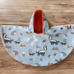 Skunk, Porcupine, Fox Car Seat Poncho fits 6 months to 6 years. It&#39;s Reversible, Hooded and Car Seat Safe to keep Kids Warm