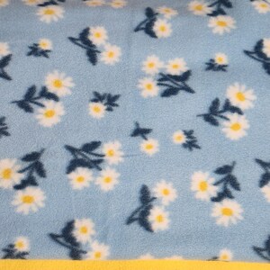 Blue Daisy Floral Car Seat Poncho fits 6 months to 6 years. It&#39;s Reversible, Hooded and Car Seat Safe to keep Kids Warm.