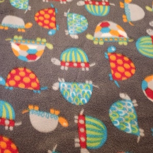 Colorful Turtles Car Seat Poncho fits 6 months to 6 years. It&#39;s Reversible, Hooded and Car Seat Safe to keep Kids Warm