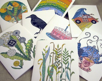 May include: Set of 8 blank greeting cards with colorful, intricate illustrations. The designs include a tree, a crow, a cake, dandelions, a teapot, a car, and abstract patterns.