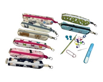 Knitting and crochet travel notions kit filled with accessories,  handy clip on knit bag travel kit, stitch markers, travel scissors,