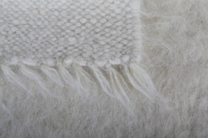 White handmade wool throw.