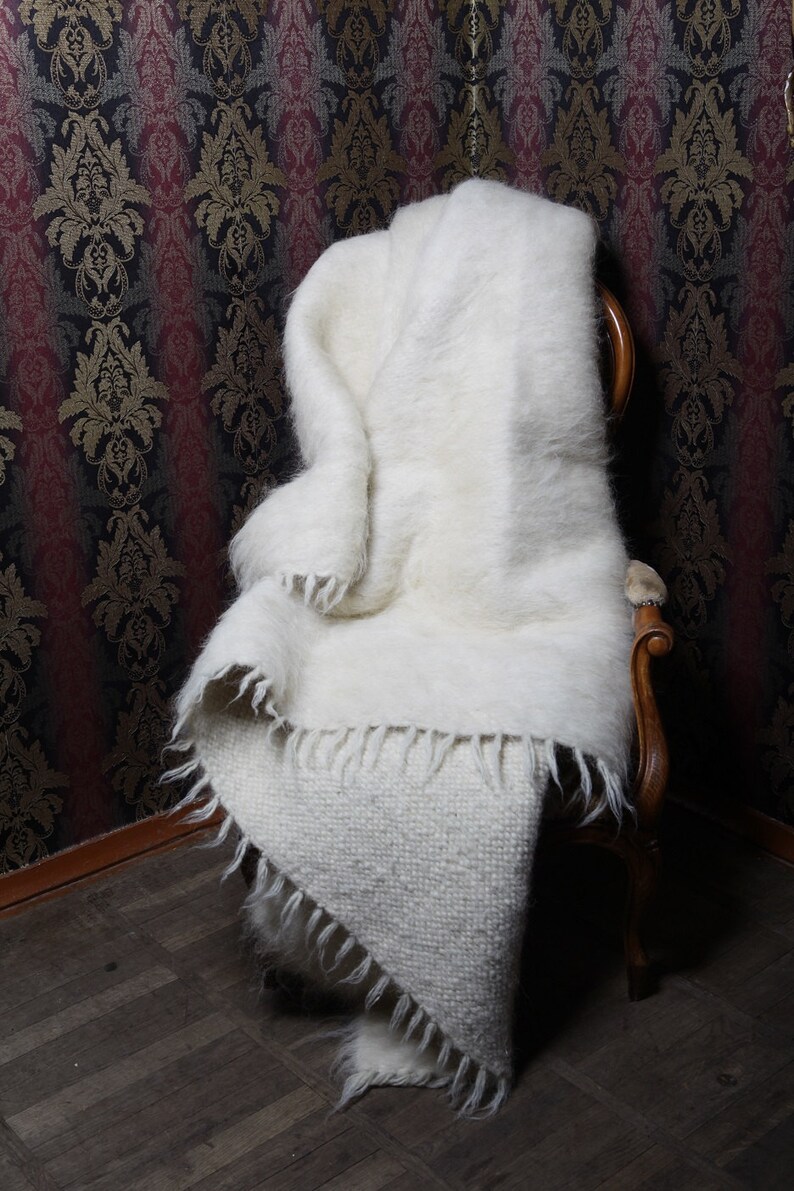 White handmade wool throw.