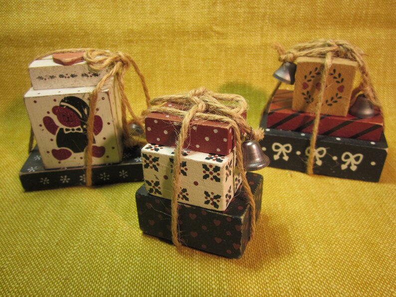 3 painted wooden block gift package ornaments tied with