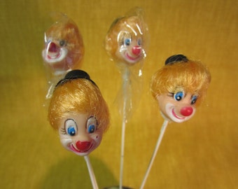 4 clown heads on wire picks, yellow hair, black hat,1", for dolls, crafts, floral, etc.
