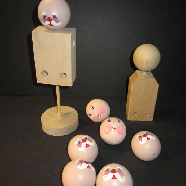 8 wood round doll heads and 2 bodies ,2" balls, 5 painted Santa faces , 2 elf faces, one blank, one dowel stand