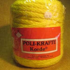 May include: A yellow spool of cord labeled "POLI-KRAFTE Korde®" with the text "TEXTILE ENTERPRISES, INC. Quincy, FLA 32351 Whitesburg, GA 30188" on the label. The price tag reads "10.99".