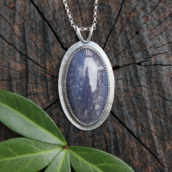 Leland Blue pendant in handmade sterling silver setting with pine tree, magically translucent, snowy night scene