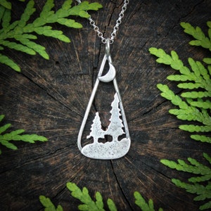 Moonlit forest pendant in sterling silver, two pines and crescent moon.