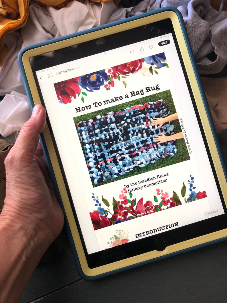 May include: A tablet displays a tutorial titled "How To make a Rag Rug" with floral accents. The tutorial shows a colorful woven rug. The text includes "by the Swedish flicka felicity barmettler" and "Page 2 of 32".