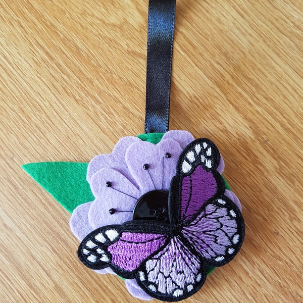 Felt flower and butterfly Christmas bauble in purple