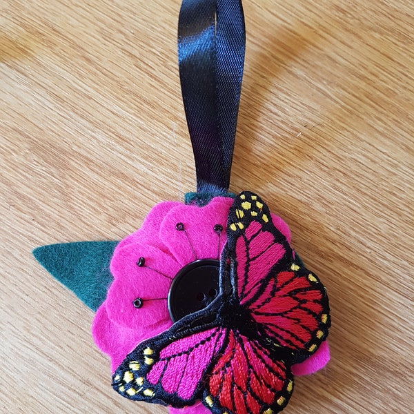 Felt flower and butterfly Christmas bauble in dark pink