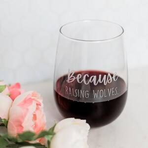 Personalized wine glass for mom - because raising wolves