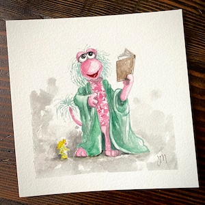 May include: A watercolor painting of a pink furry monster wearing a green robe and holding a brown book. A small yellow creature stands to the left of the monster.