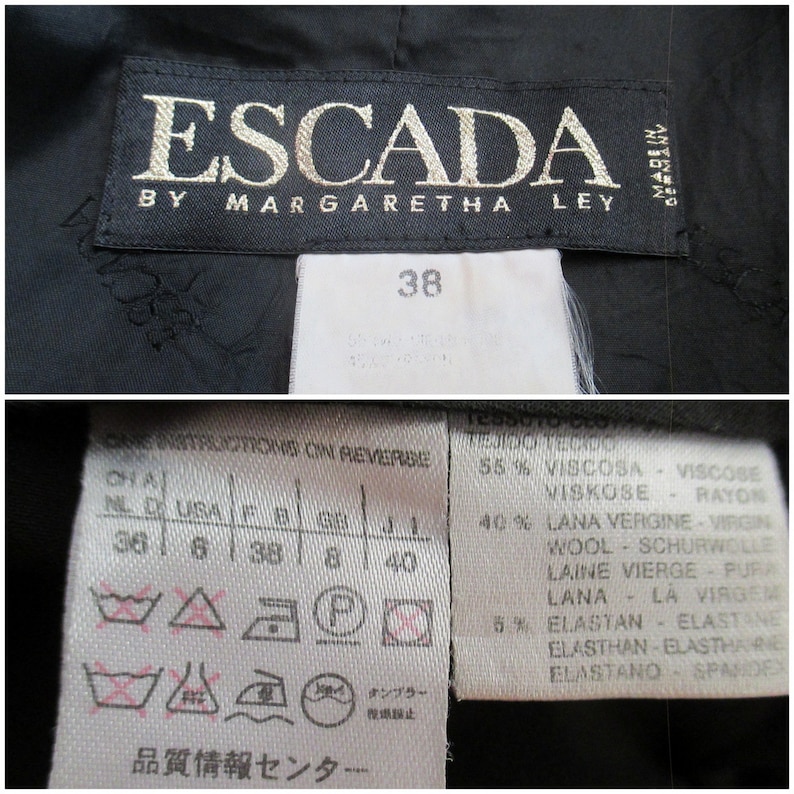 May include: Close-up of a black Escada label with gold lettering, reading "ESCADA BY MARGARETHA LEY MADE IN GERMANY." Below, a white tag displays the size "38" and fabric content details. Additional care symbols are also visible.