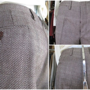 May include: Brown herringbone patterned pants with a button on the back pocket.