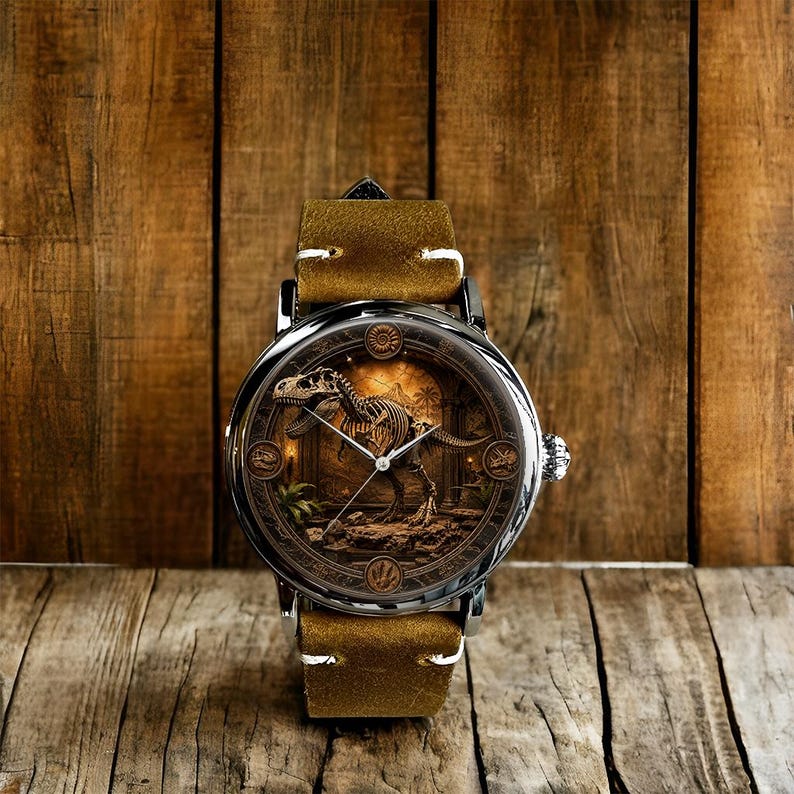 May include: A wristwatch with a detailed dinosaur skeleton design on the face. The watch has a silver case, a brown leather band, and a textured dial. The background is a wooden surface.