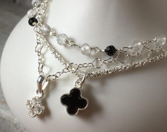 Sterling silver triple strand bracelet with black Onyx clover