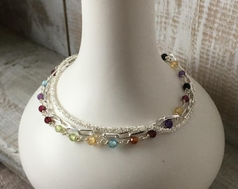 Sterling silver triple strand bracelet with gemstones