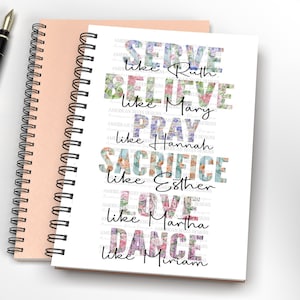 May include: Two spiral-bound notebooks, one peach and one white, with a black pen on a white surface. The white notebook features floral text that reads "SERVE like Ruth, BELIEVE like Mary, PRAY like Hannah, SACRIFICE like Esther, LOVE like Martha, DANCE like Miriam."