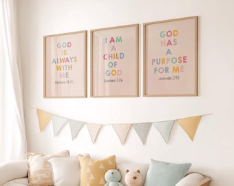May include: Three framed prints with inspirational quotes about God. The prints are in a light pink color with colorful text. The quotes are "God is always with me", "I am a child of God", and "God has a purpose for me".