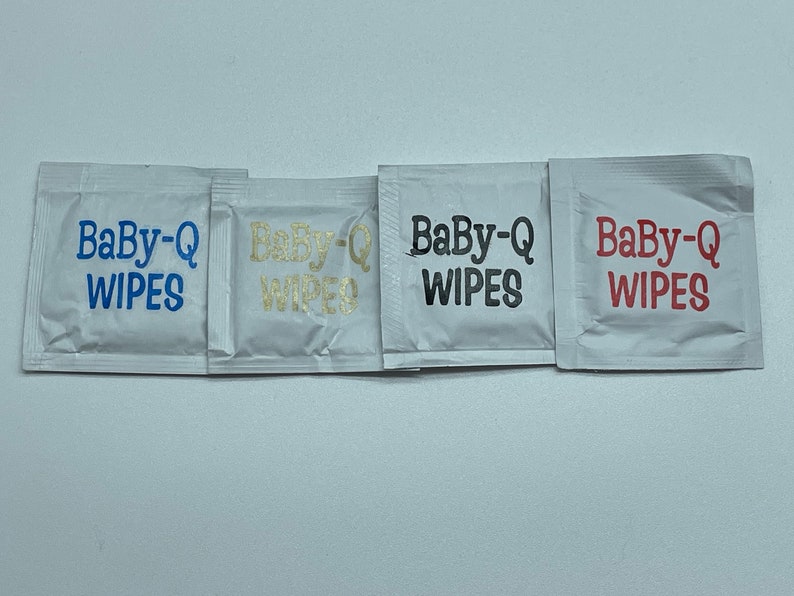 May include: Four individual packets of Baby-Q wipes, each with the brand name printed in a different color: blue, gold, black, and red.